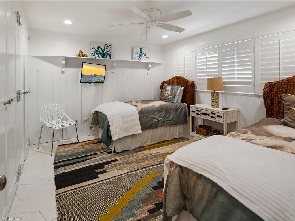 436 Golfview Drive Naples, FL 34110 - Photo 25 of 44 a bedroom with bed and a window