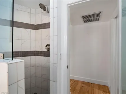 a bathroom with a bathtub and shower