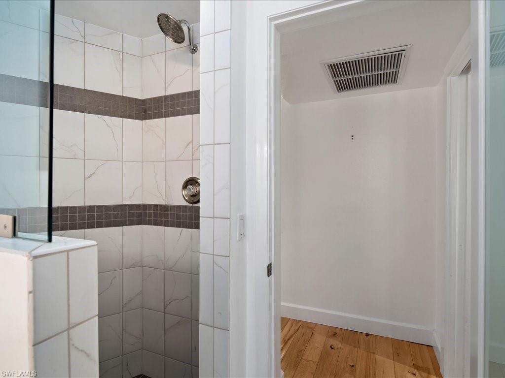 436 Golfview Drive Naples, FL 34110 - Photo 28 of 44 a bathroom with a bathtub and shower