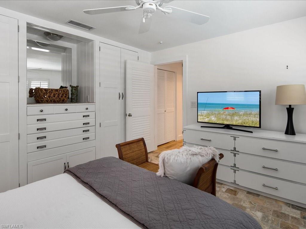 436 Golfview Drive Naples, FL 34110 - Photo 29 of 44 a living room with furniture and a flat screen tv