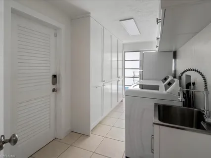 a kitchen with a sink and cabinets