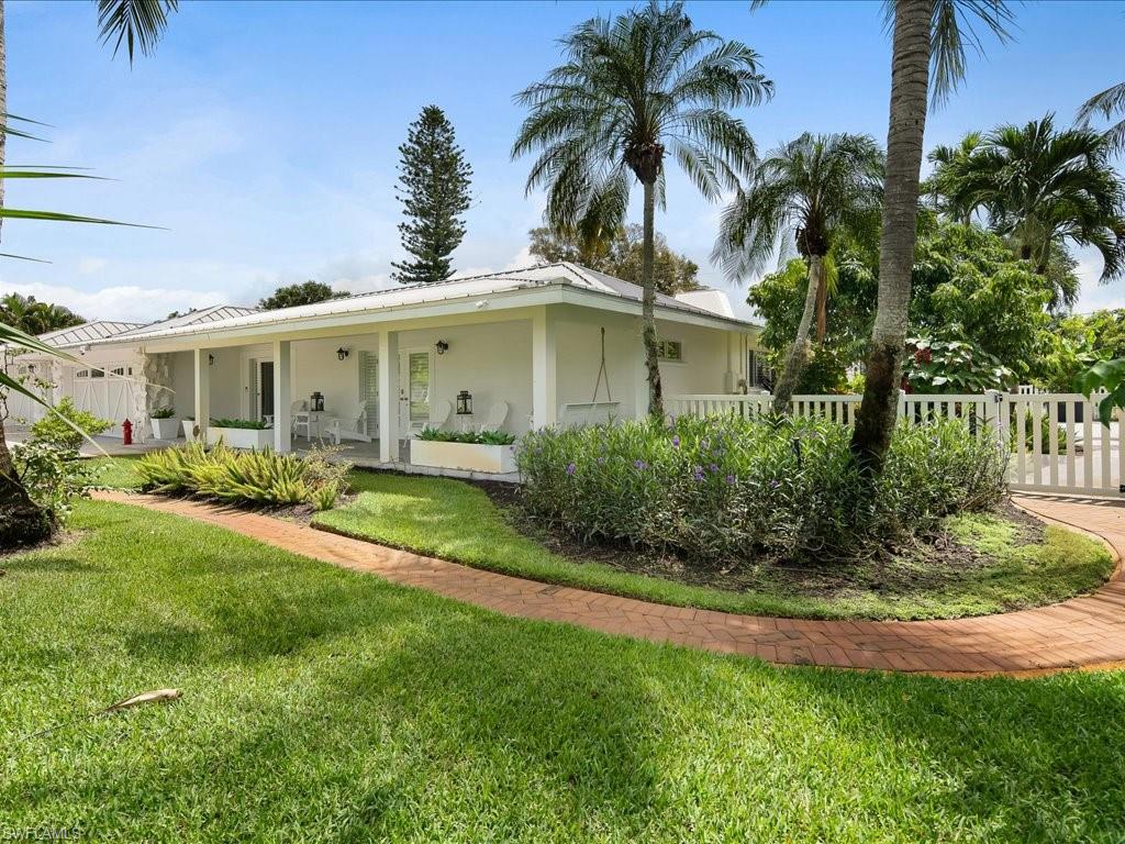 436 Golfview Drive Naples, FL 34110 - Photo 36 of 44 a front view of house with yard and green space