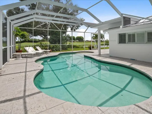 a view of a house with a backyard porch and sitting area