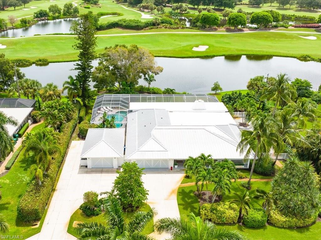436 Golfview Drive Naples, FL 34110 - Photo 43 of 44 a view of a lake with a big yard