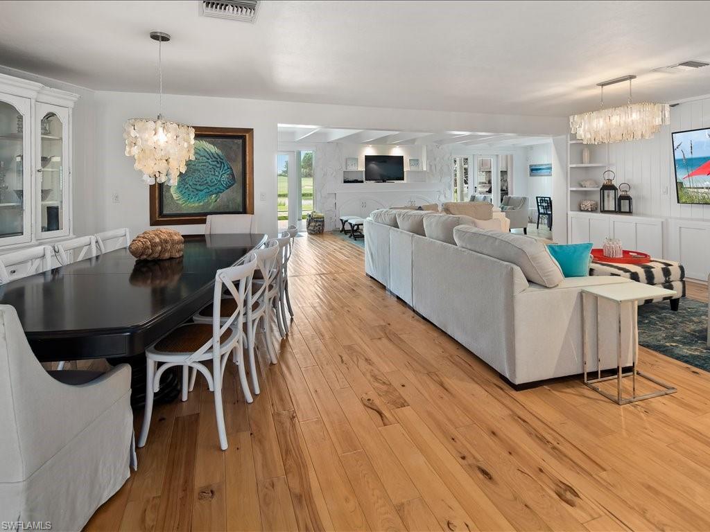436 Golfview Drive Naples, FL 34110 - Photo 7 of 44 a living room with furniture and a wooden floor