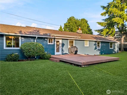 a front view of a house with a yard table and chairs