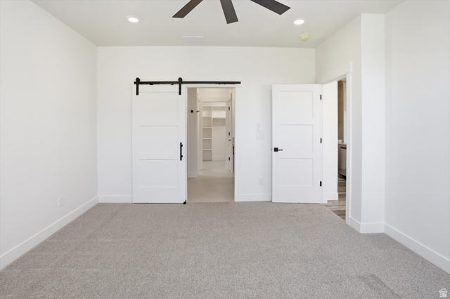 1315 West 3200 South, Unit 17 Perry, UT 84302 - Photo 29 of 58 Spacious room featuring neutral carpeting and white walls