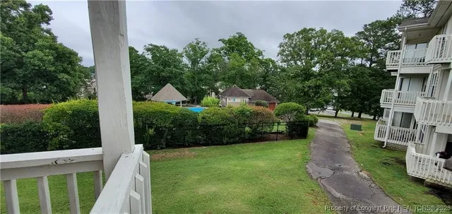 a view of a balcony with wooden floor