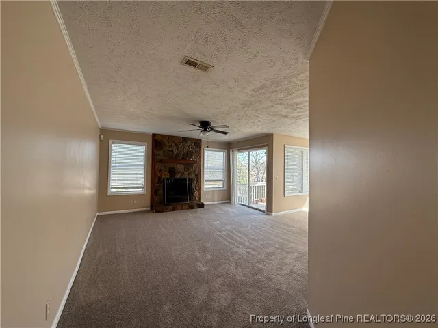 a view of a livingroom with a fireplace