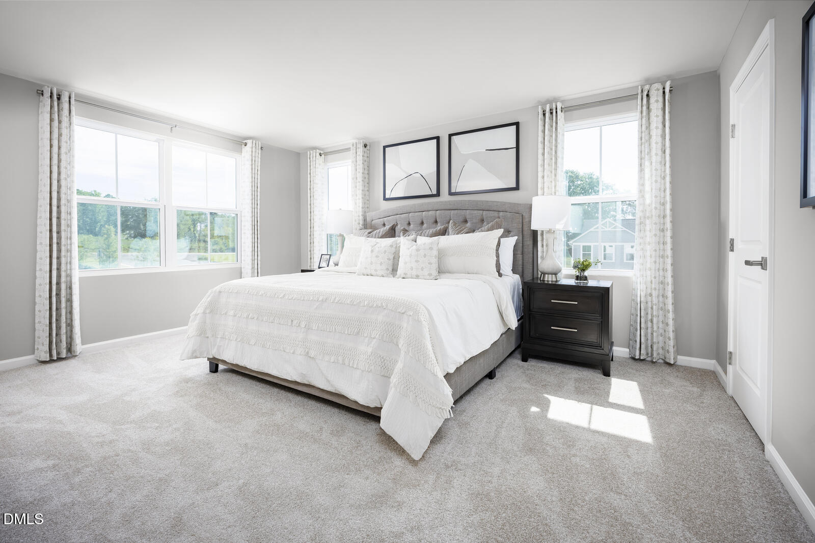 1007 Merlin Street Durham, NC 27704 - Photo 11 of 18 a bedroom with a bed and a large window