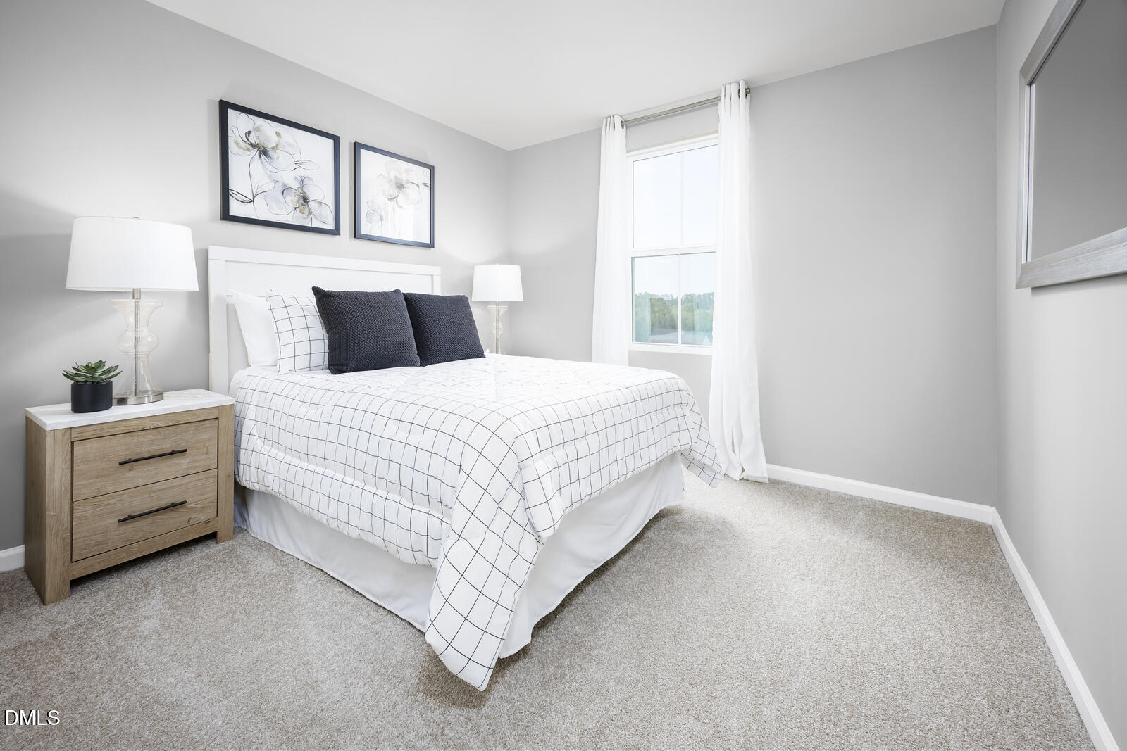 1007 Merlin Street Durham, NC 27704 - Photo 14 of 18 a bedroom with a bed and a window