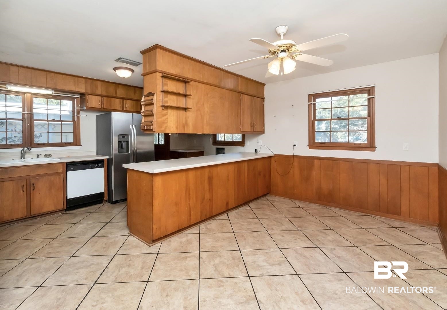 4543 Kingsway Drive Mobile, AL 36608 - Photo 9 of 28 Kitchen featuring light countertops, a sink, stainless steel fridge, dishwasher, and a peninsula