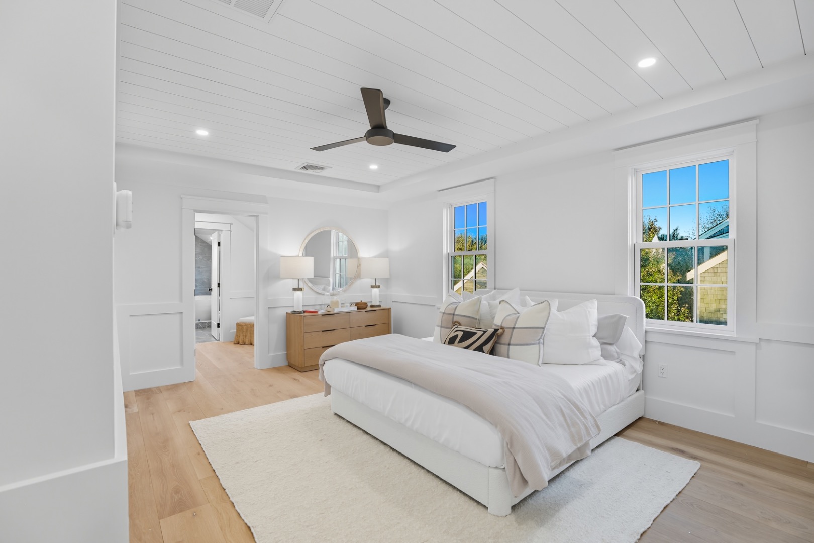 2 Mariner Way Nantucket, MA 02554 - Photo 20 of 34 a large bedroom with a large bed a chandelier and windows