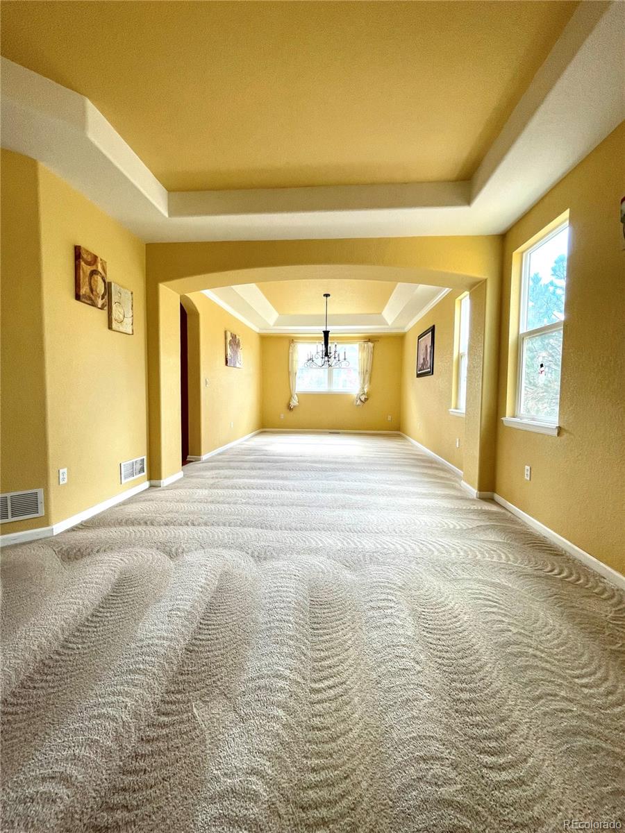16866 East Peakview Avenue Aurora, CO 80016 - Photo 14 of 27 a view of an empty room with a window
