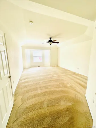 a view of a room with a white wall