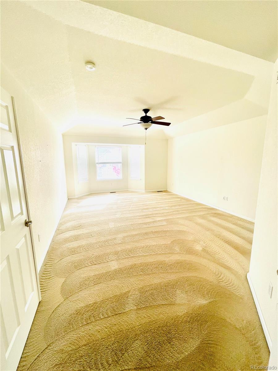 16866 East Peakview Avenue Aurora, CO 80016 - Photo 19 of 27 a view of a room with a white wall