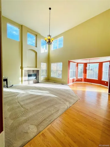 a view of an empty room with a kitchen