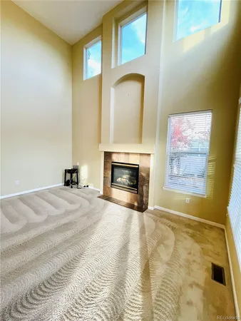 a view of a bedroom with a bed and a fireplace