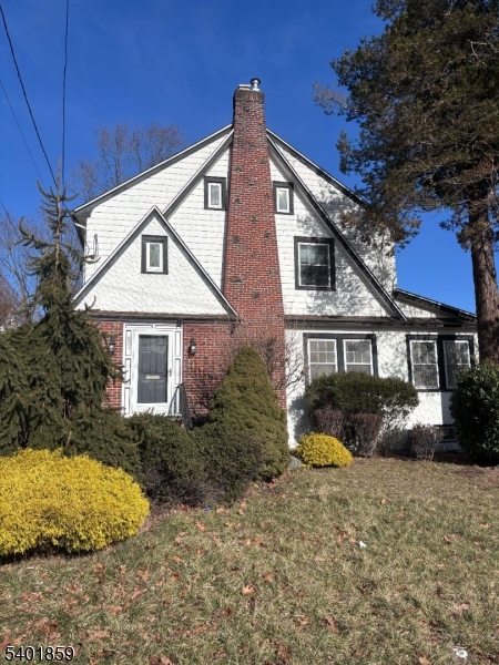 61 Luddington Road West Orange, NJ 07052 - Photo 1 of 25 a front view of a house with a yard