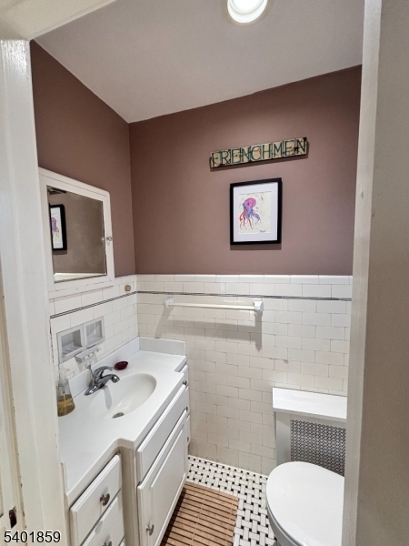 61 Luddington Road West Orange, NJ 07052 - Photo 14 of 25 a bathroom with a sink and a mirror
