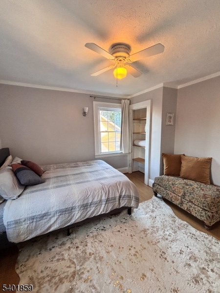 61 Luddington Road West Orange, NJ 07052 - Photo 16 of 25 a bedroom with a bed and ceiling fan