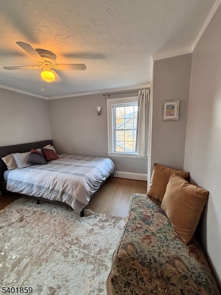 61 Luddington Road West Orange, NJ 07052 - Photo 17 of 25 a bedroom with a bed and window
