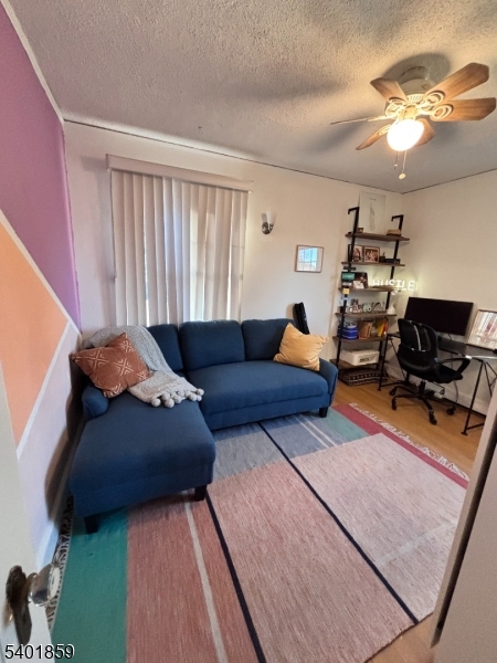 61 Luddington Road West Orange, NJ 07052 - Photo 18 of 25 a living room with furniture and a flat screen tv