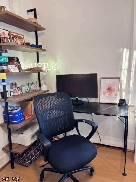 61 Luddington Road West Orange, NJ 07052 - Photo 19 of 25 a living room with furniture and a lamp