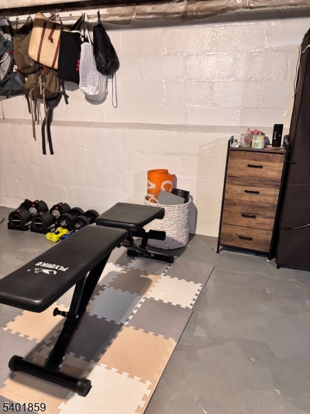 61 Luddington Road West Orange, NJ 07052 - Photo 23 of 25 a room with gym equipment and view of living room