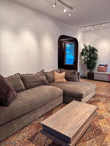 61 Luddington Road West Orange, NJ 07052 - Photo 3 of 25 a living room with furniture and flowers