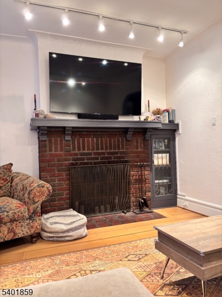 61 Luddington Road West Orange, NJ 07052 - Photo 6 of 25 a living room with furniture and a flat screen tv
