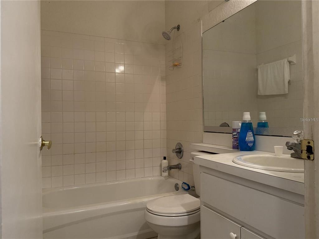 871 Reflections Loop East Winter Haven, FL 33884 - Photo 11 of 23 a bathroom with a sink a toilet and shower