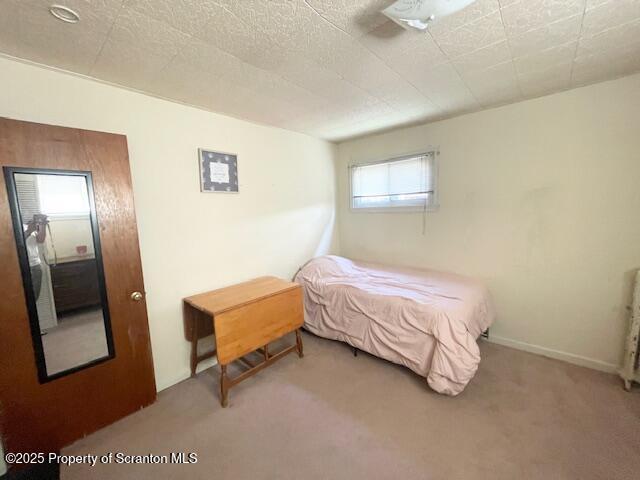 2106 Boulevard Scranton Pa Scranton, PA 18509 - Photo 12 of 21 a bedroom with a bed and a mirror