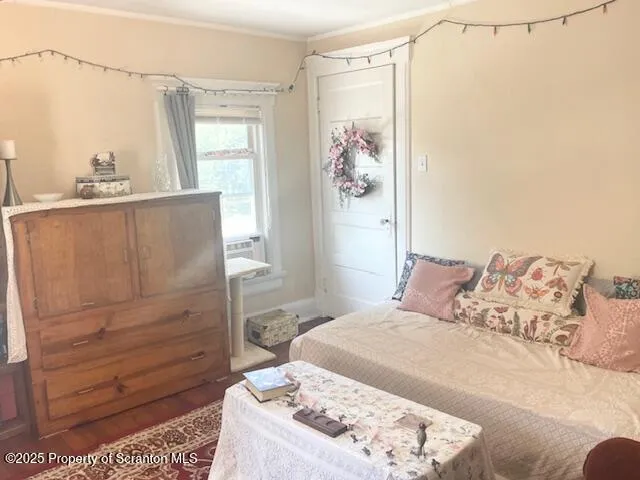 a bedroom with a bed and a dresser