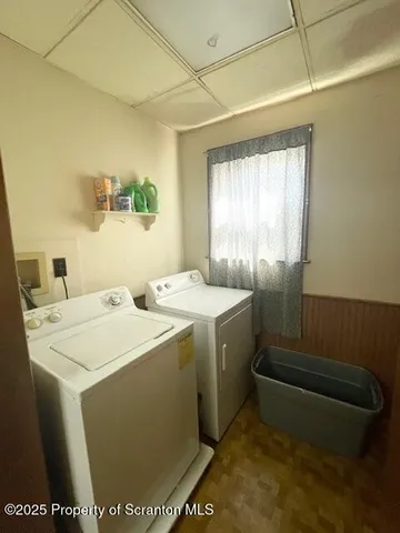 a room with sink washer and dryer