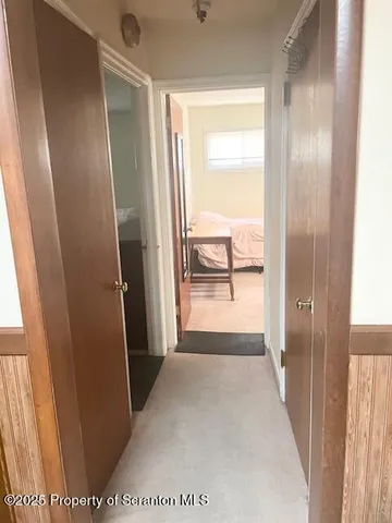 a view of hallway with a large window