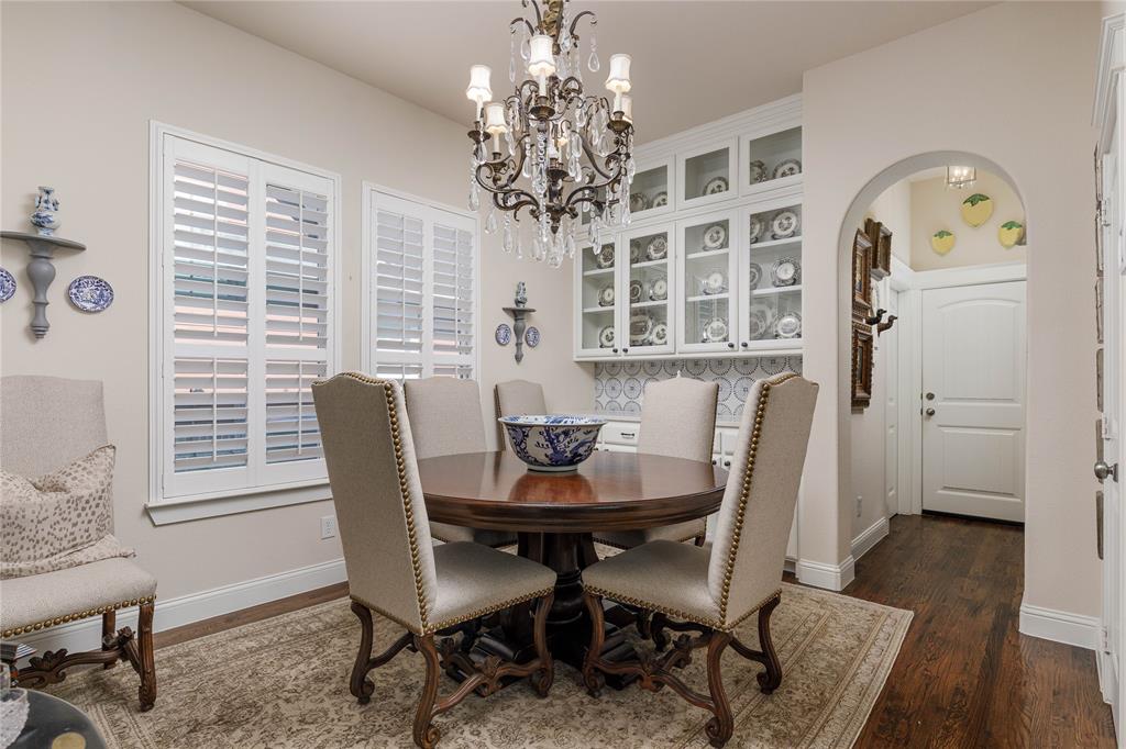 2500 Addison Street McKinney, TX 75071 - Photo 12 of 33 Dining space is highlighted by beautiful display cabinetry.