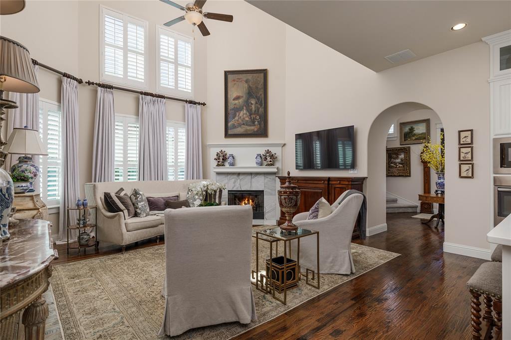 2500 Addison Street McKinney, TX 75071 - Photo 7 of 33 Living area features high ceilings, a fireplace and an abundance of light.