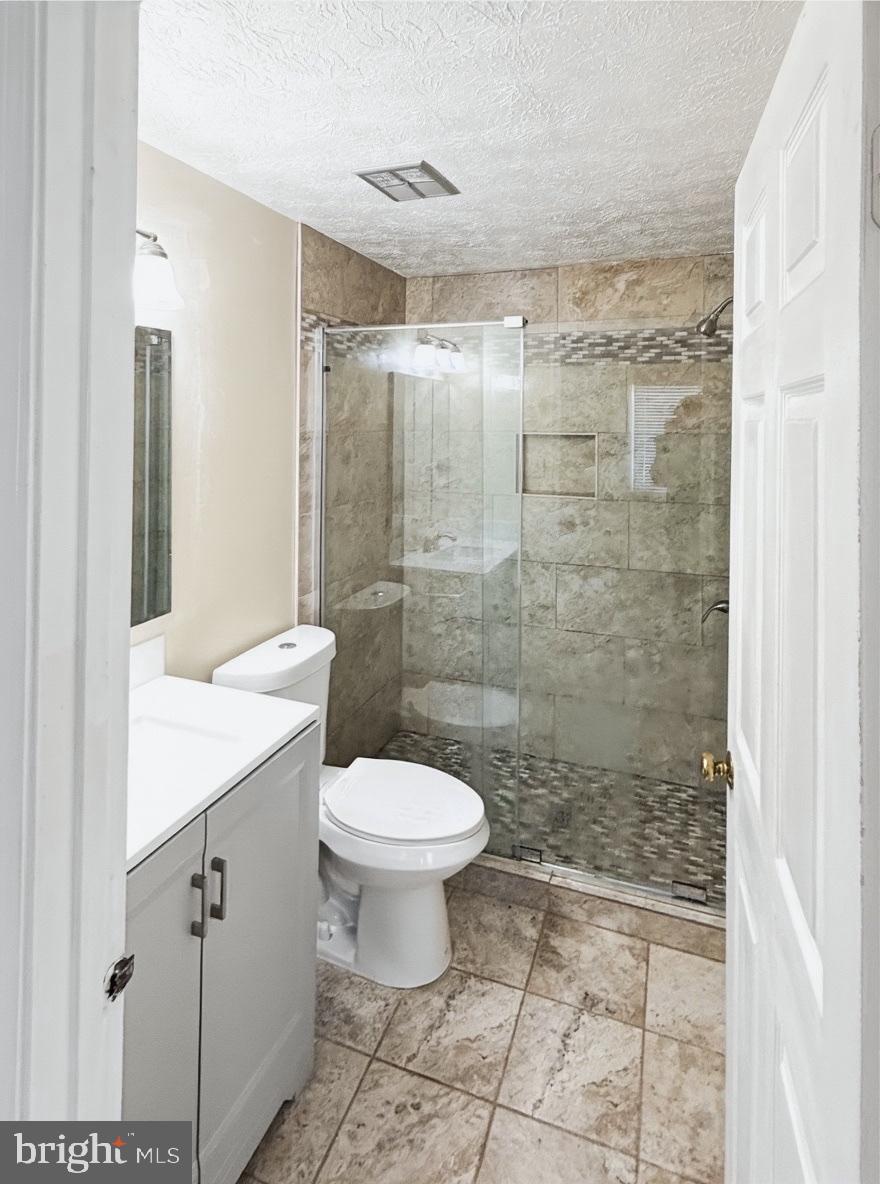 14106 Aldora Circle Silver Spring, MD 20904 - Photo 16 of 25 Modern Primary Bathroom with elegant tile accents