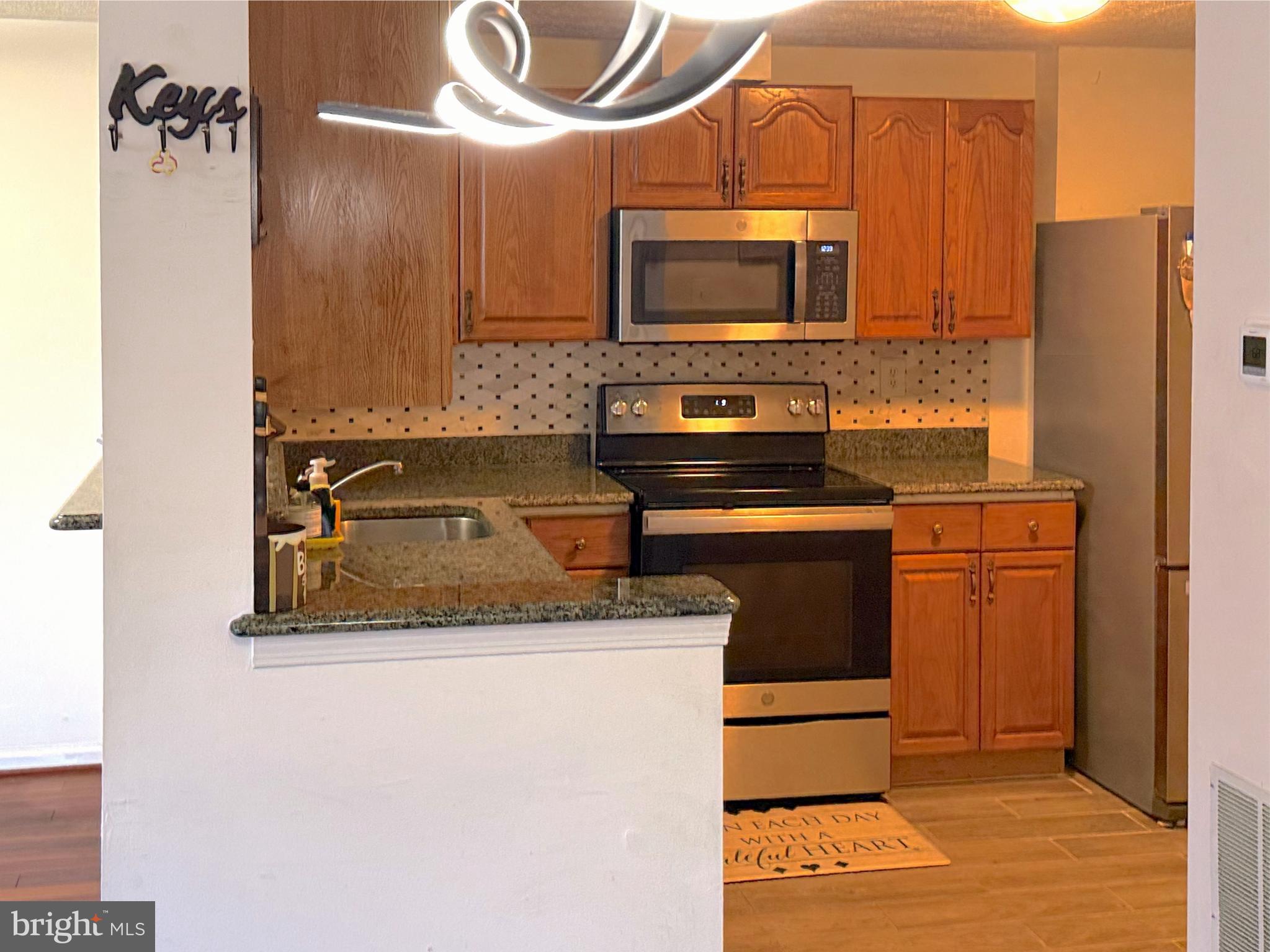 14106 Aldora Circle Silver Spring, MD 20904 - Photo 6 of 25 Modern kitchen with sleek finishes.