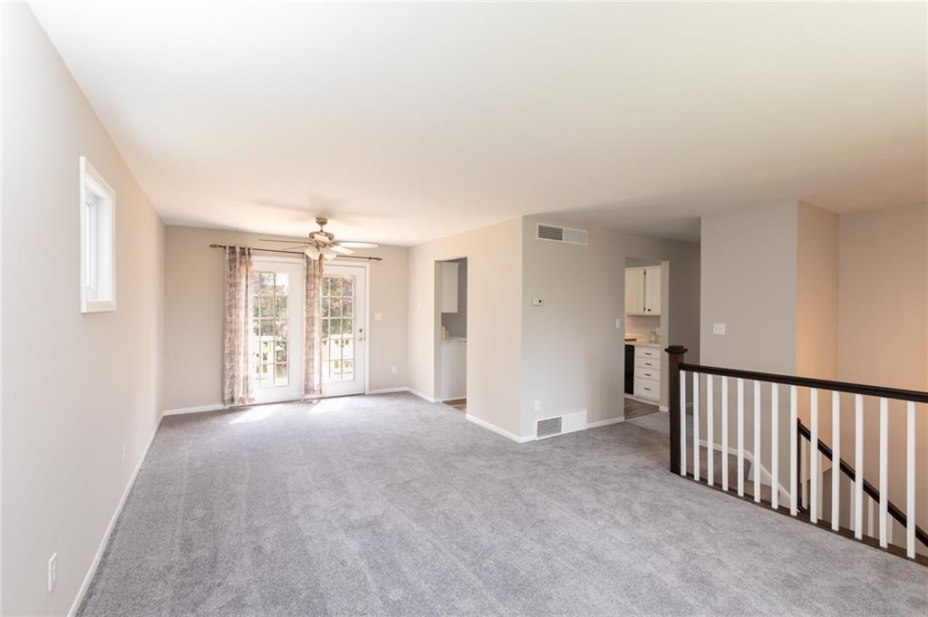 1929 Bakerstown Road Tarentum, PA 15084 - Photo 4 of 22 a view of a big room with windows and entryway of the house