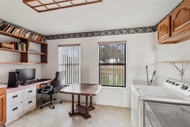 a room with furniture a rug and a window