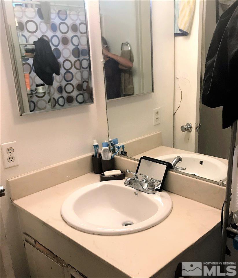 3551 Willow Reno, NV 89512 - Photo 11 of 15 a bathroom with a sink and a mirror