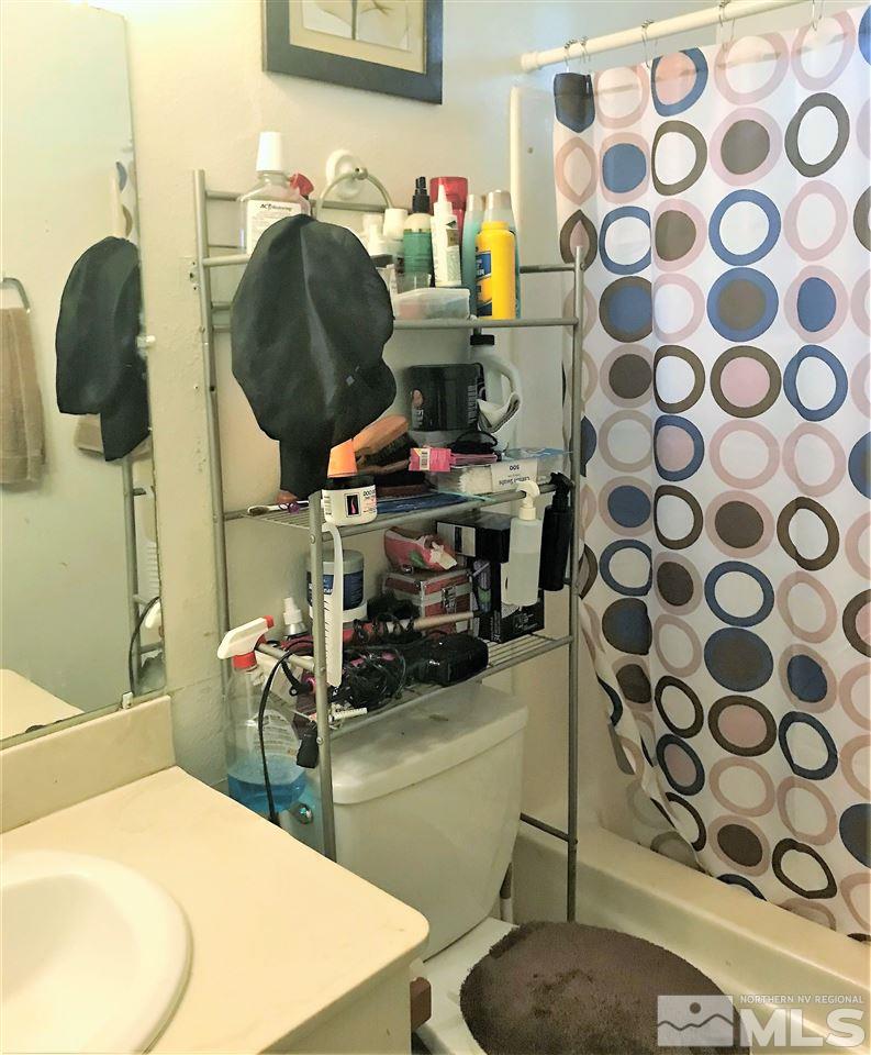 3551 Willow Reno, NV 89512 - Photo 12 of 15 a bathroom with a sink toilet and mirror