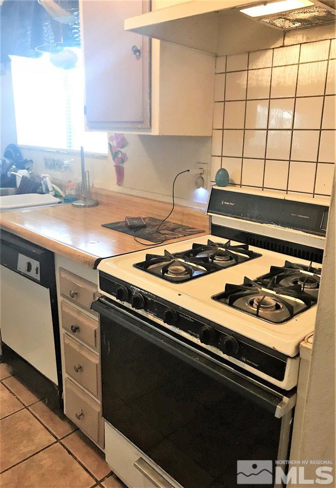 3551 Willow Reno, NV 89512 - Photo 5 of 15 a stove top oven sitting inside of a kitchen