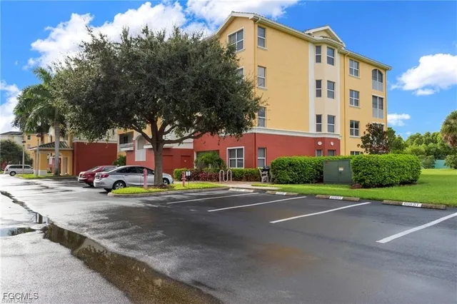 a view of a parked cars in front of a building