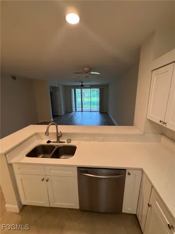 a kitchen with a sink and cabinets
