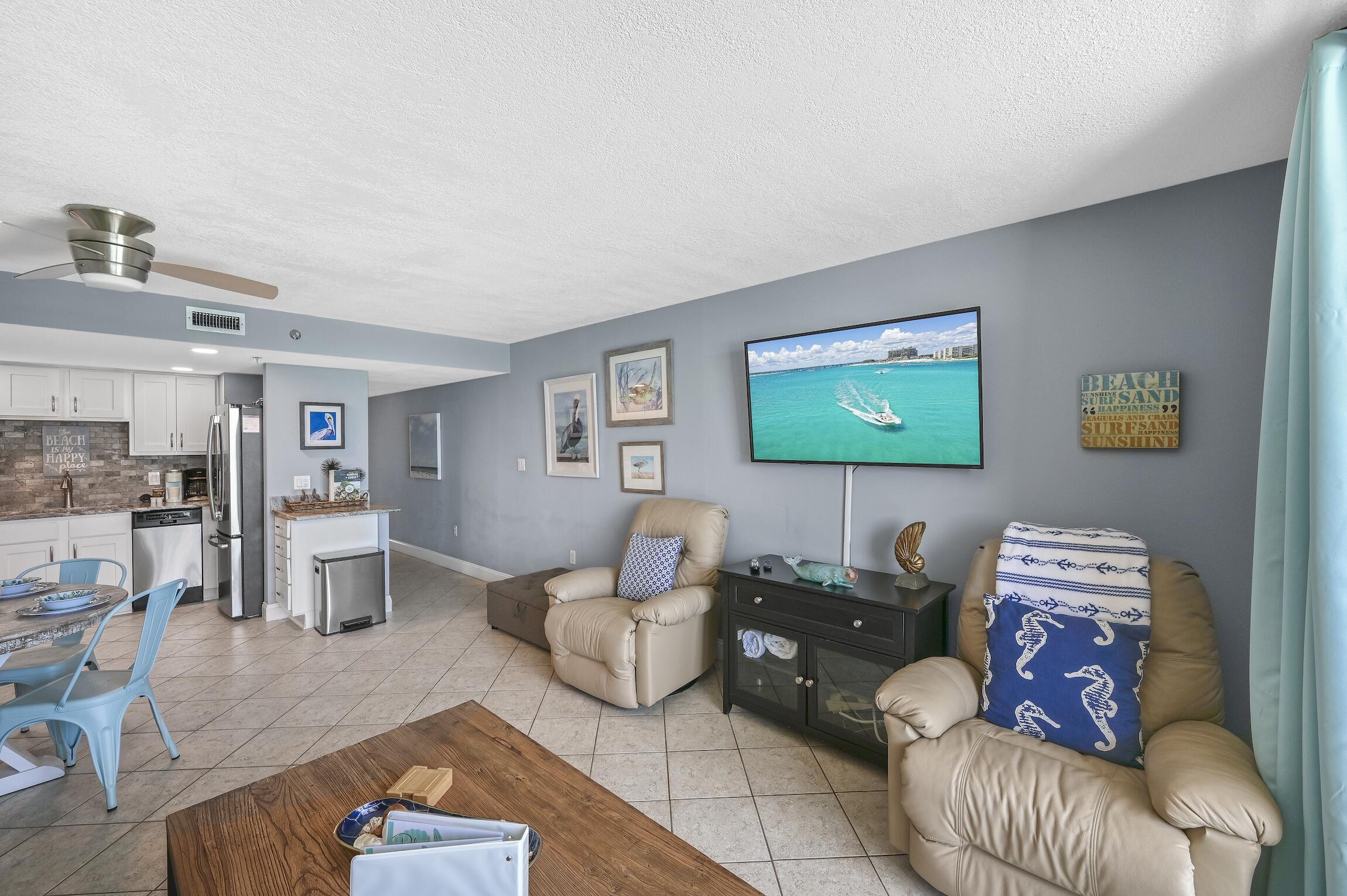 1040 Highway 98, Unit 802 Destin, FL 32541 - Photo 8 of 27 a living room with furniture and a flat screen tv