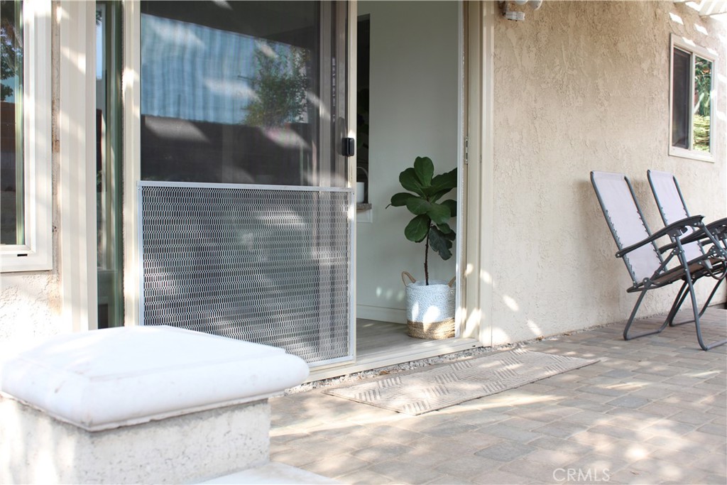 2052 South June Place Anaheim, CA 92802 - Photo 11 of 12 a view of a door and chair in the patio