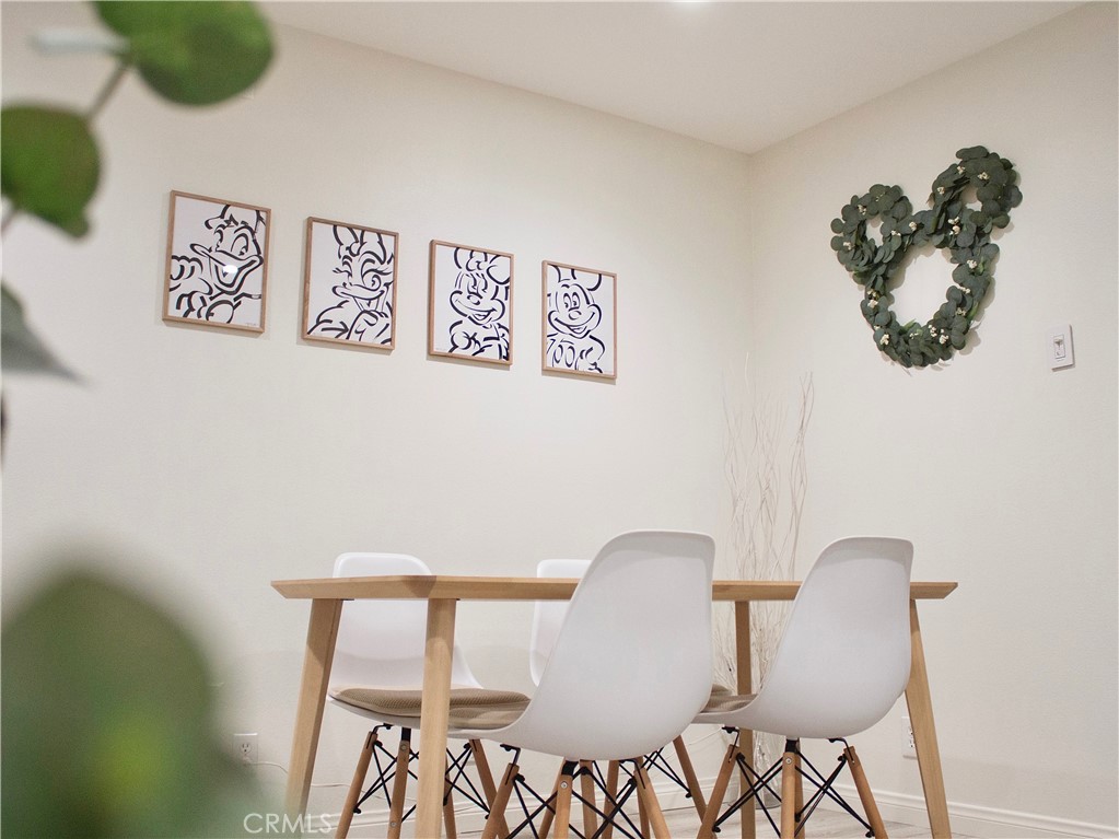 2052 South June Place Anaheim, CA 92802 - Photo 4 of 12 a view of a dining room with furniture and wooden floor
